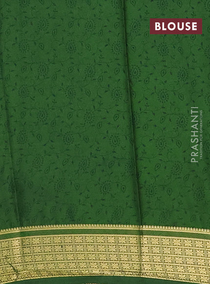 Semi mysore silk saree dark mustard and green with allover floral prints and zari woven border