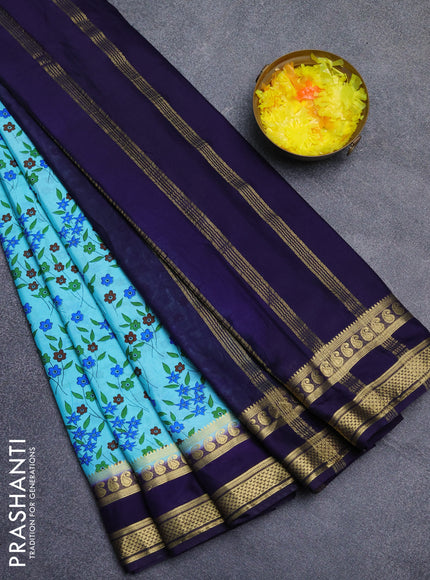 Semi mysore silk saree light blue and navy blue with allover floral prints and rettapet zari woven border