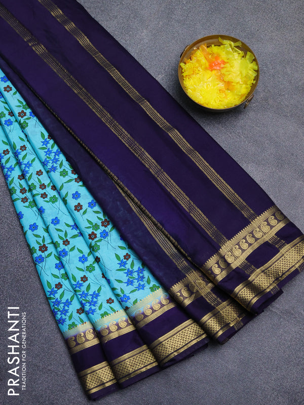 Semi mysore silk saree light blue and navy blue with allover floral prints and rettapet zari woven border
