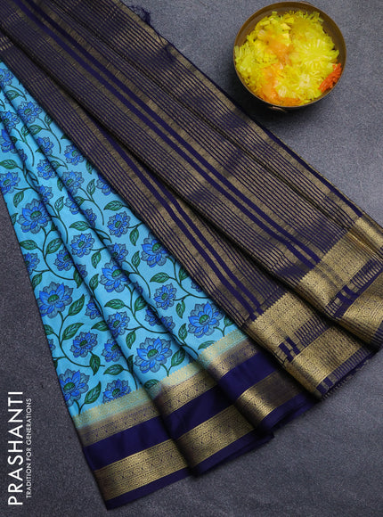 Semi mysore silk saree light blue and navy blue with allover floral prints and rettapet zari woven border