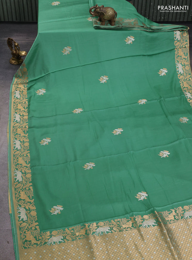 Art mushru silk saree pastel green with silver & gold zari woven buttas and zari woven border