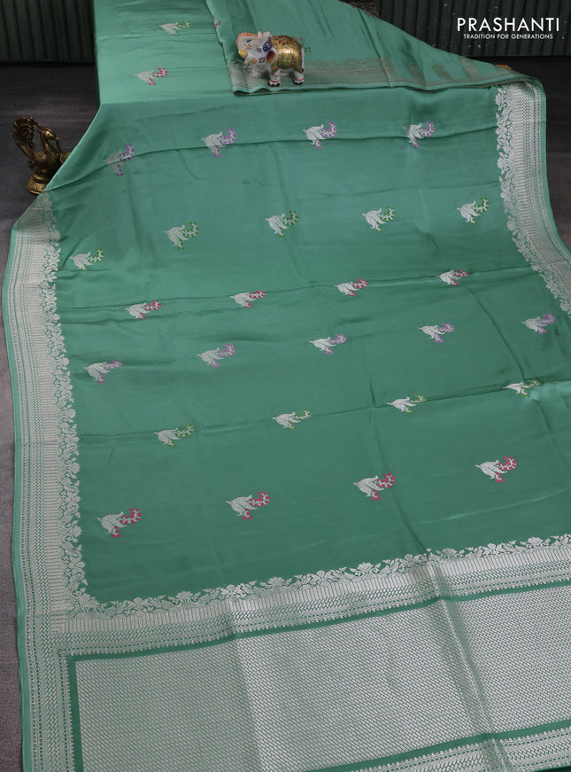 Art mushru silk saree teal green shade with zari woven buttas and zari woven border