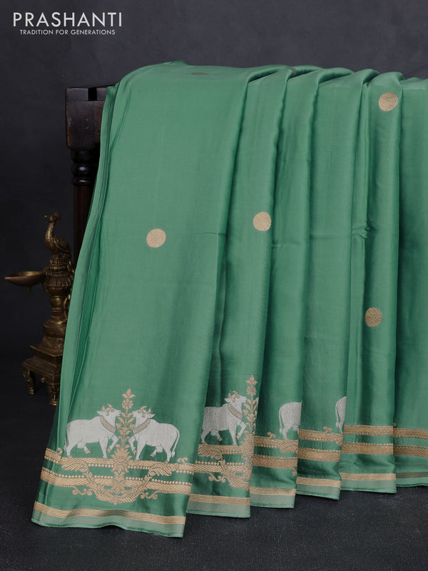 Art mushru silk saree pastel green with zari woven coin buttas and zari woven border