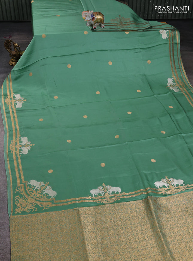 Art mushru silk saree pastel green with zari woven coin buttas and zari woven border