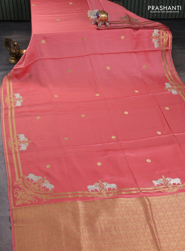 Art mushru silk saree peach shade with zari woven coin buttas and zari woven border
