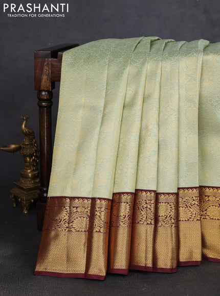 Pure kanchipuram silk saree pista green and maroon with allover zari woven brocade weaves and long rich zari woven border