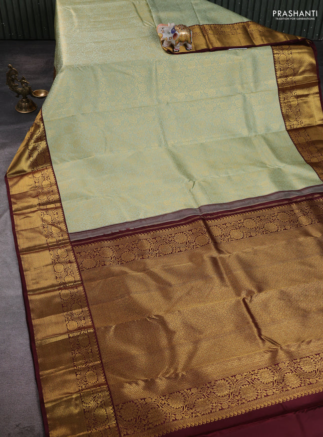 Pure kanchipuram silk saree pista green and maroon with allover zari woven brocade weaves and long rich zari woven border