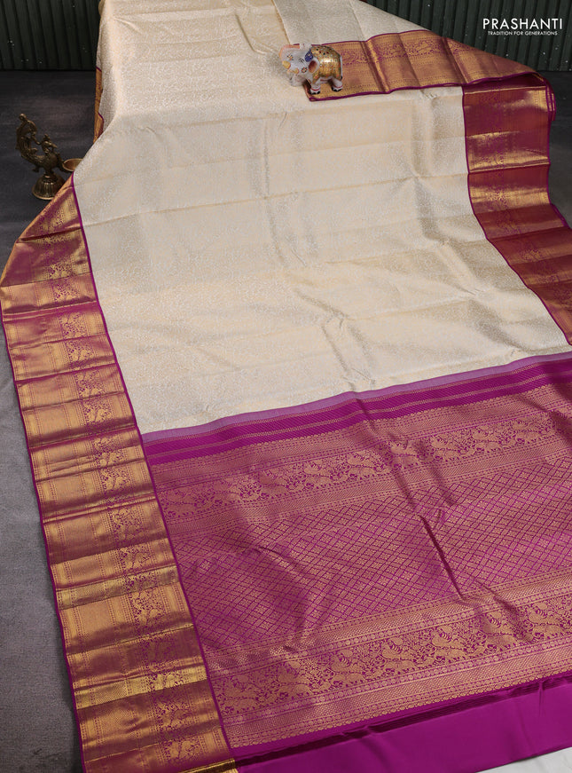 Pure kanchipuram silk saree cream and purple with allover zari woven brocade weaves and long rich zari woven border