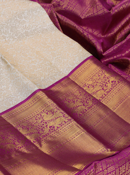 Pure kanchipuram silk saree cream and purple with allover zari woven brocade weaves and long rich zari woven border
