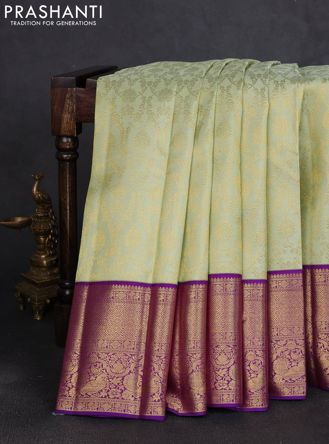 Pure kanchipuram silk saree pista green and violet with allover zari woven brocade weaves and long rich zari woven border