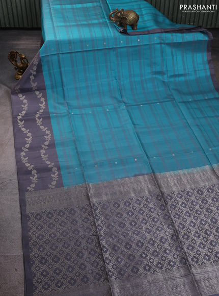 Pure soft silk saree teal blue and grey with allover stripe pattern & zari buttas and long zari woven border