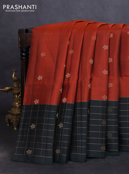 Pure soft silk saree rustic orange and bottle green with zari woven floral buttas and long zari woven checked border