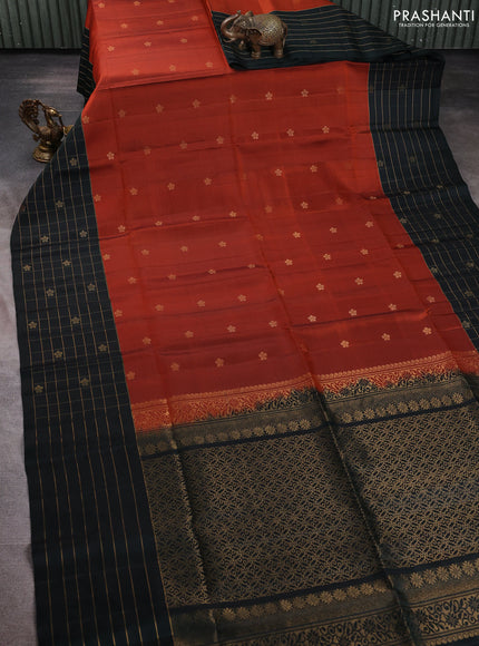 Pure soft silk saree rustic orange and bottle green with zari woven floral buttas and long zari woven checked border