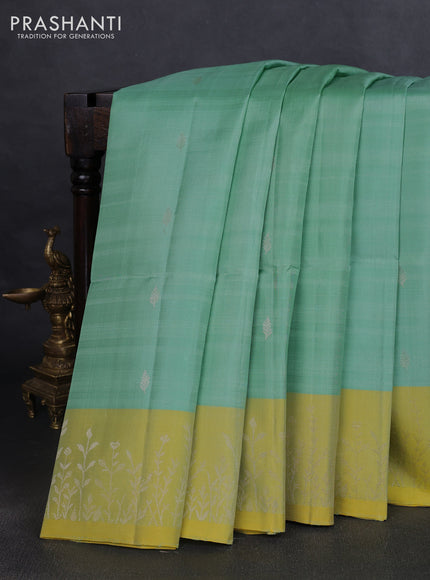 Pure soft silk saree teal green shade and dual shade of yellow with zari woven buttas and zari woven border