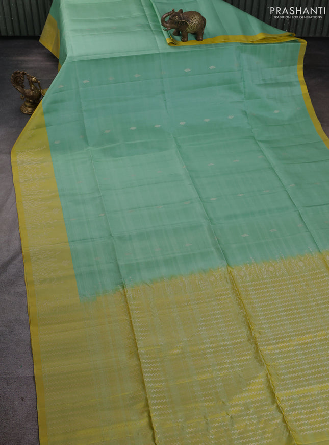 Pure soft silk saree teal green shade and dual shade of yellow with zari woven buttas and zari woven border