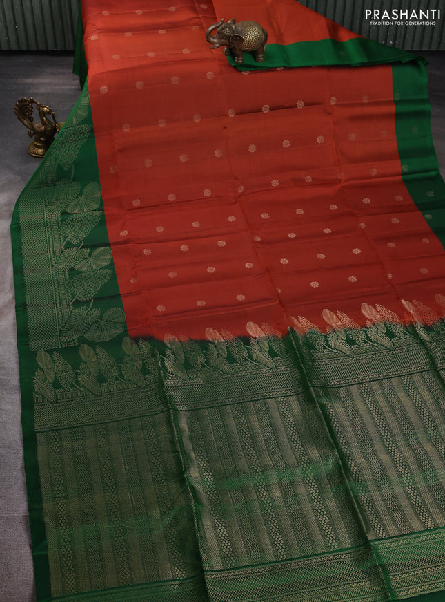 Pure soft silk saree rustic orange and green with allover zari woven buttas and long zari woven border