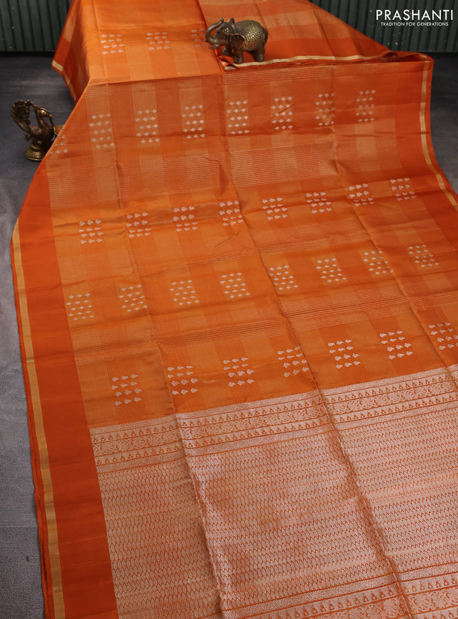 Pure soft silk saree orange with allover zari checks & buttas and simple zari woven border