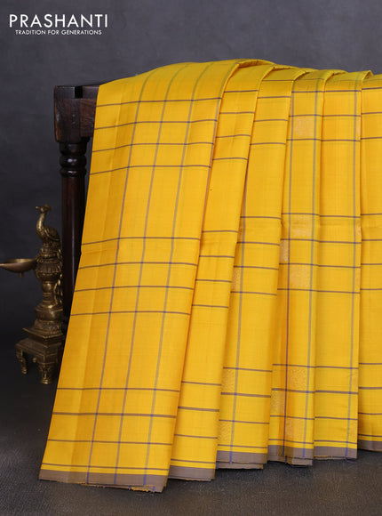 Pure soft silk saree yellow and grey with allover checks & zari buttas and piping border