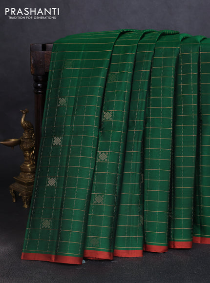 Pure soft silk saree green and rustic orange with allover zari checks & buttas and piping border