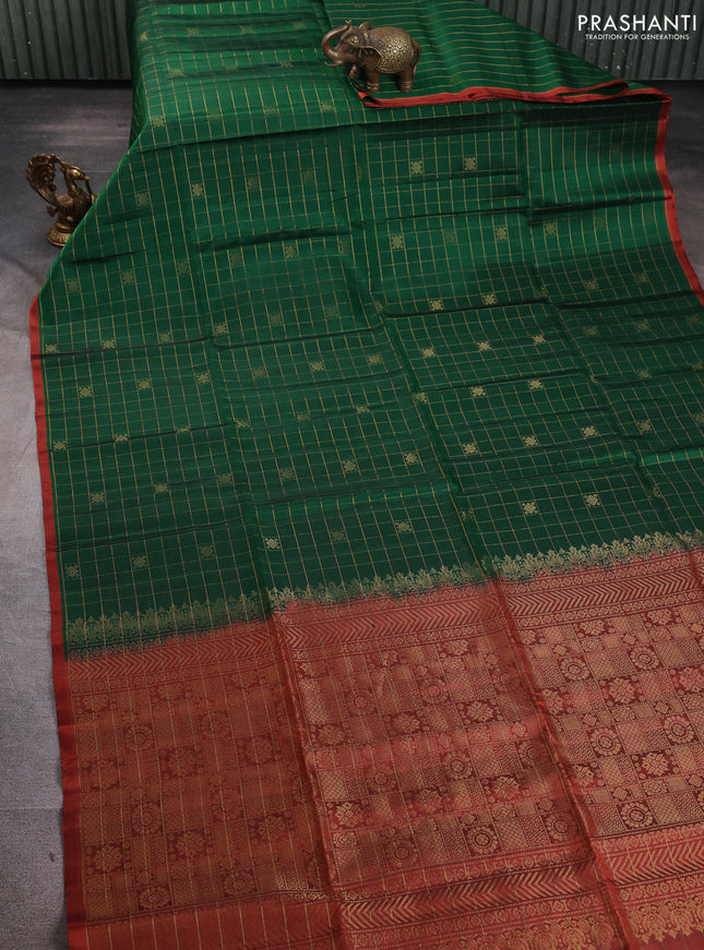 Pure soft silk saree green and rustic orange with allover zari checks & buttas and piping border