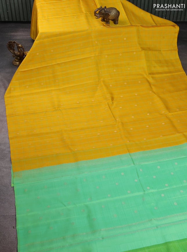 Pure soft silk saree yellow and dual shade of teal green with allover checks & zari buttas in borderless style