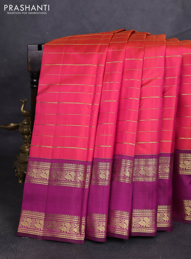 Pure kanchipuram silk saree dual shade of pinkish orange and purple with allover zari weaves and rettapet zari woven border