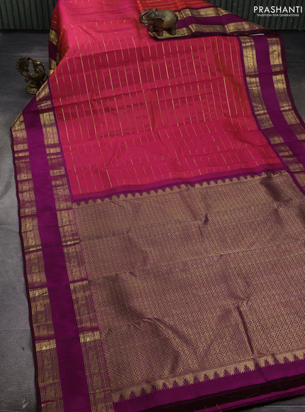 Pure kanchipuram silk saree dual shade of pinkish orange and purple with allover zari weaves and rettapet zari woven border