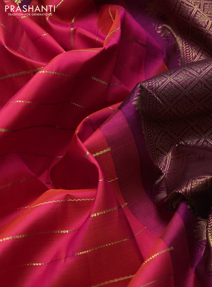 Pure kanchipuram silk saree dual shade of pinkish orange and purple with allover zari weaves and rettapet zari woven border