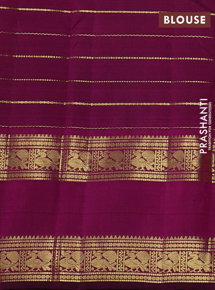 Pure kanchipuram silk saree dual shade of pinkish orange and purple with allover zari weaves and rettapet zari woven border