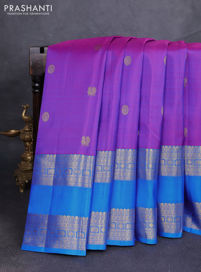 Pure kanchipuram silk saree purple and cs blue with allover zari woven buttas and long rettapet zari woven border