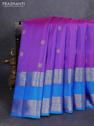 Pure kanchipuram silk saree purple and cs blue with allover zari woven buttas and long rettapet zari woven border