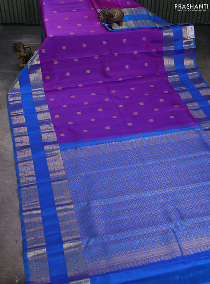 Pure kanchipuram silk saree purple and cs blue with allover zari woven buttas and long rettapet zari woven border