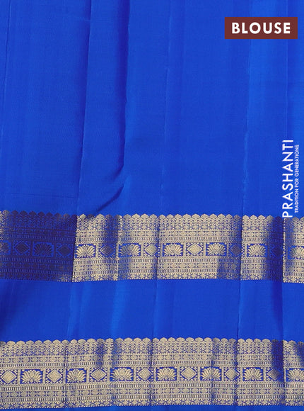 Pure kanchipuram silk saree purple and cs blue with allover zari woven buttas and long rettapet zari woven border