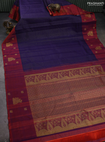 Pure kanchipuram silk saree navy blue and rustic orange with allover small zari checked pattern and long zari woven butta border