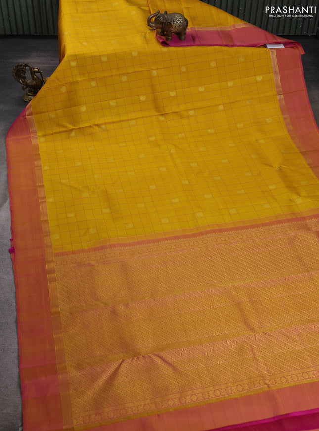 Pure kanchipuram silk saree mustard yellow and pink with allover thread checks & buttas and zari woven simple border