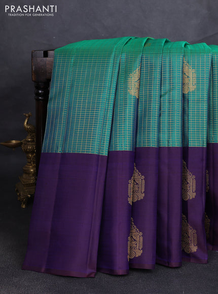 Pure kanchipuram silk saree dual shade of bluish green and navy blue with allover zari checks & buttas and long simple zari woven buttas