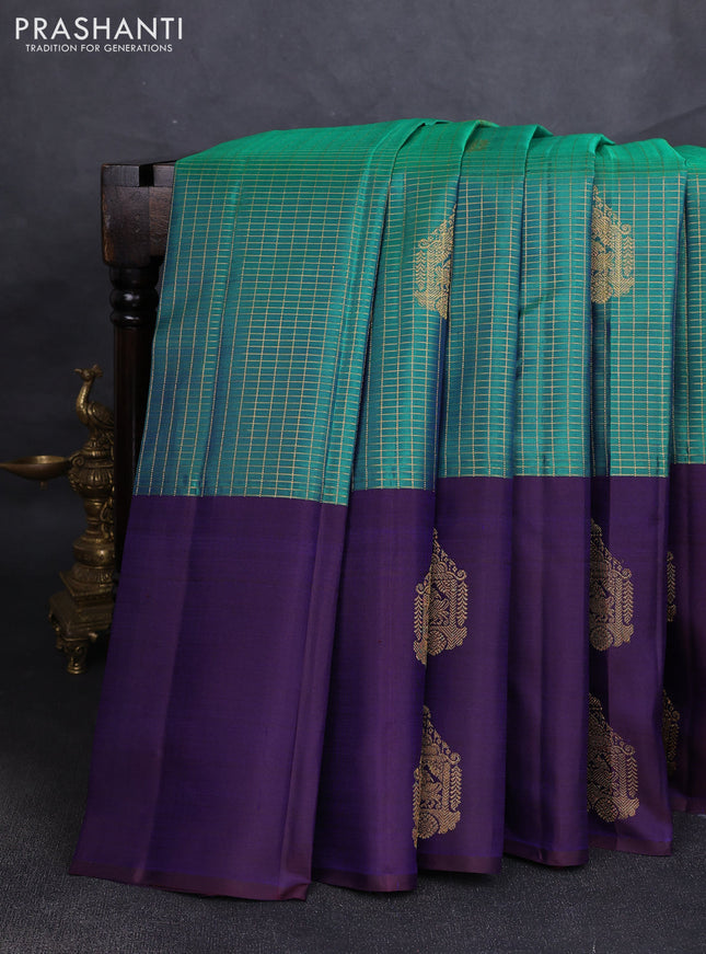 Pure kanchipuram silk saree dual shade of bluish green and navy blue with allover zari checks & buttas and long simple zari woven buttas