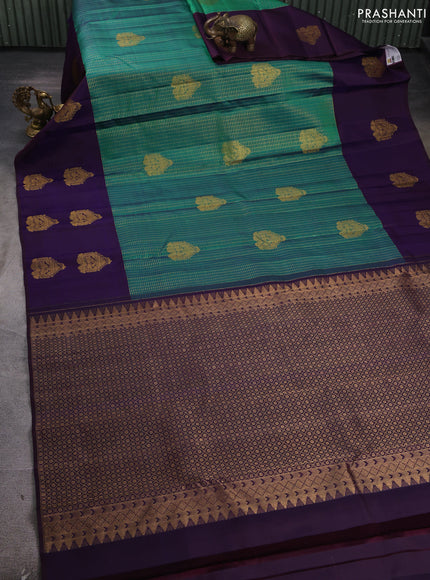 Pure kanchipuram silk saree dual shade of bluish green and navy blue with allover zari checks & buttas and long simple zari woven buttas