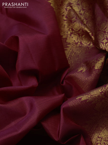 Pure kanchipuram silk saree deep maroon with plain body and temple zari woven border