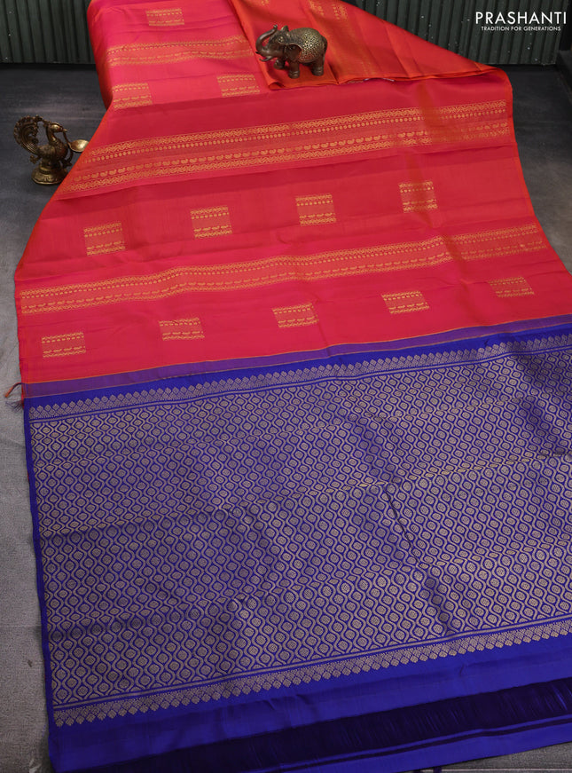 Pure kanchipuram silk saree dual shade of pinkish orange and blue with allover zari weaves & buttas in borderless style