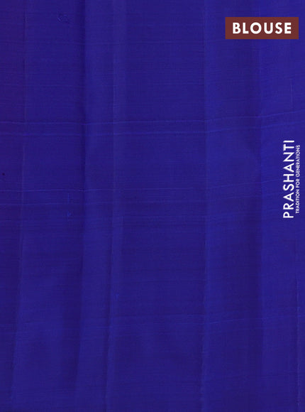 Pure kanchipuram silk saree dual shade of pinkish orange and blue with allover zari weaves & buttas in borderless style