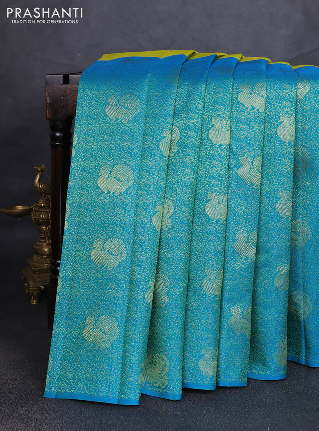 Pure kanchipuram silk saree dual shade if greenish yellow and teal blue with half & half style and long annam zari woven border