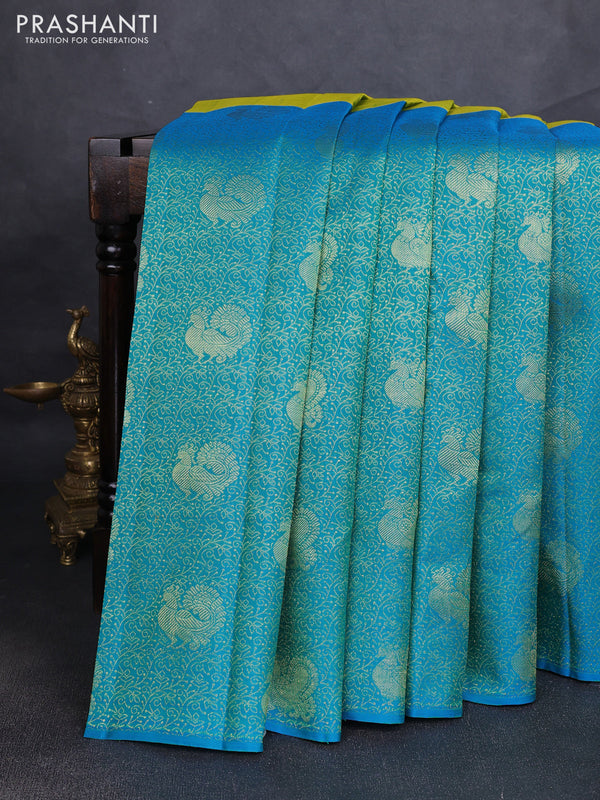 Pure kanchipuram silk saree dual shade if greenish yellow and teal blue with half & half style and long annam zari woven border