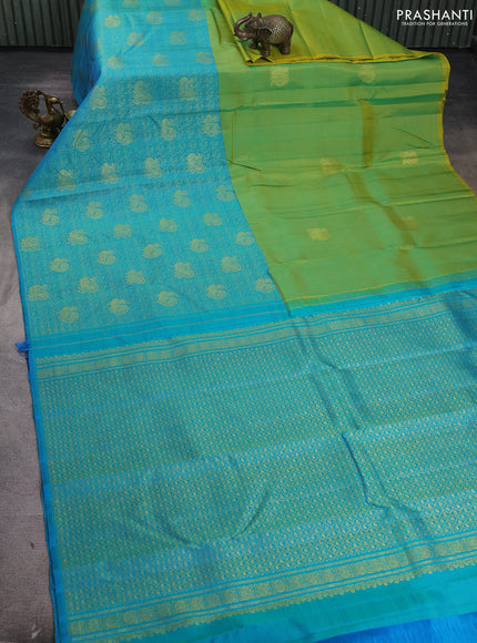 Pure kanchipuram silk saree dual shade if greenish yellow and teal blue with half & half style and long annam zari woven border