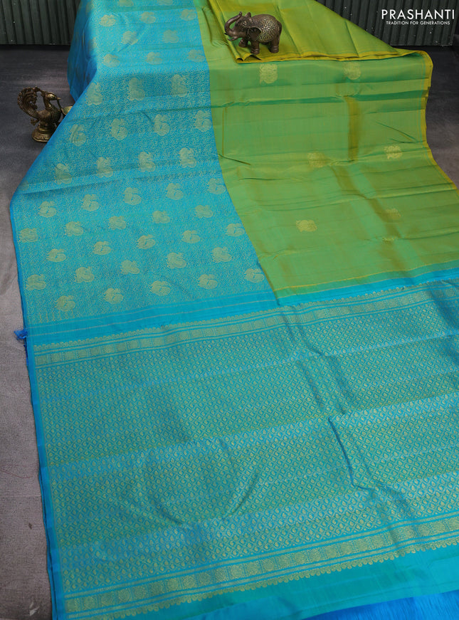 Pure kanchipuram silk saree dual shade if greenish yellow and teal blue with half & half style and long annam zari woven border