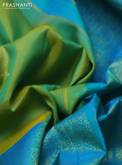 Pure kanchipuram silk saree dual shade if greenish yellow and teal blue with half & half style and long annam zari woven border