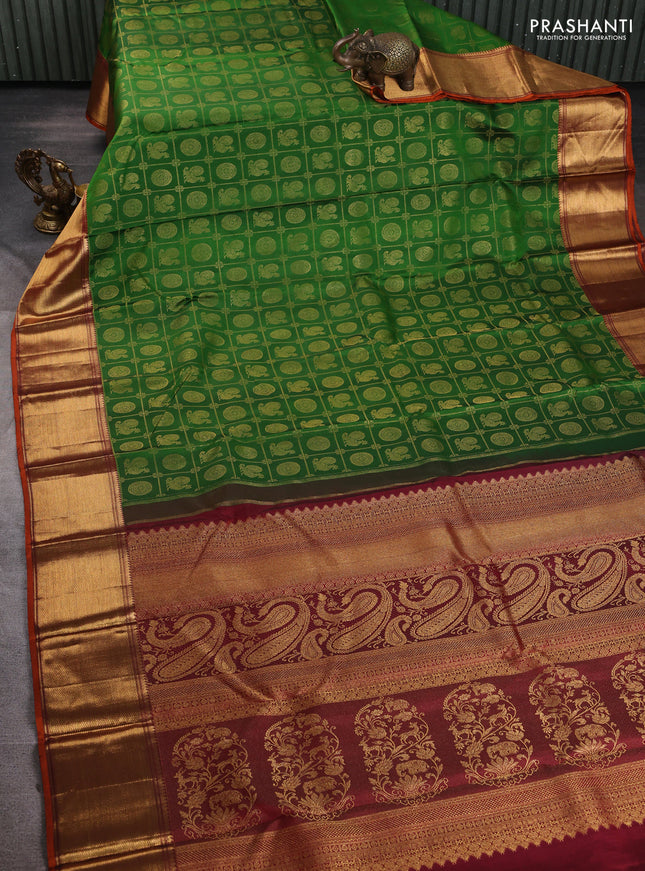 Pure kanchipuram silk saree green and maroon with allover zari woven checked brocade pattern and long rich zari woven border