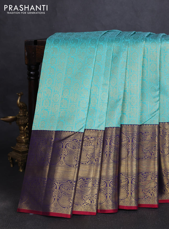 Pure kanchipuram silk saree teal blue and blue with allover zari woven checked brocade pattern and long rich zari woven border