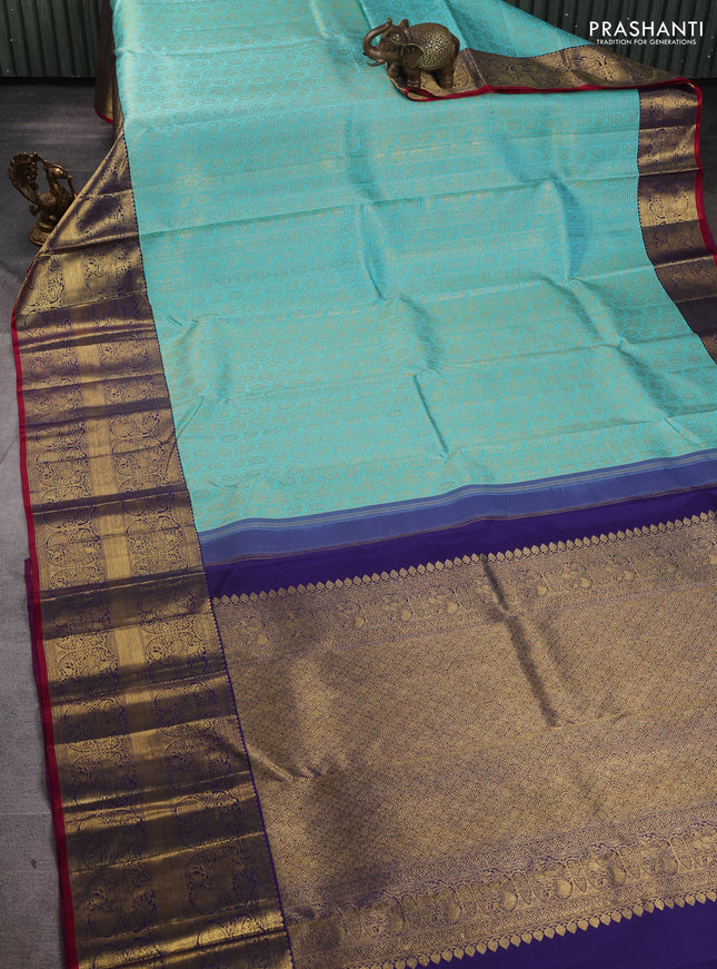 Pure kanchipuram silk saree teal blue and blue with allover zari woven checked brocade pattern and long rich zari woven border