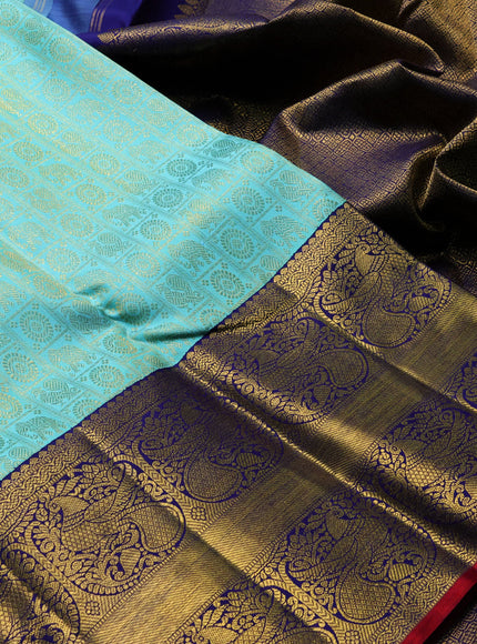 Pure kanchipuram silk saree teal blue and blue with allover zari woven checked brocade pattern and long rich zari woven border